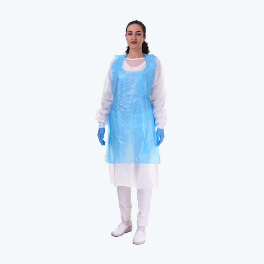 Apron. Lady standing and wearing a plastic apron made to prevent external influence on the doctor. The apron is transparent and covers the front of the body